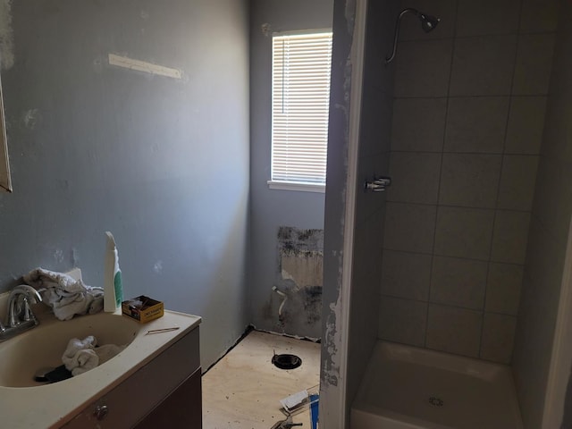 3023 E Robinson Ave, Fresno, CA 93726 - bathroom with healthy amount of natural light, a tile shower, and vanity