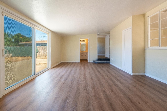 2744 E Michigan Ave, Fresno, CA 93703 - spare room featuring wood finished floors and baseboards