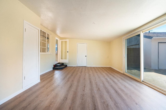 2744 E Michigan Ave, Fresno, CA 93703 - spare room with wood finished floors and baseboards