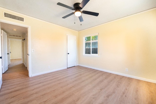 2744 E Michigan Ave, Fresno, CA 93703 - unfurnished bedroom with light wood-style flooring, baseboards, ornamental molding, and a ceiling fan