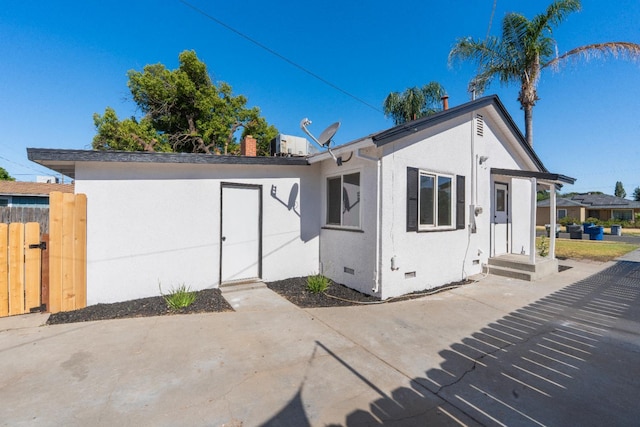2744 E Michigan Ave, Fresno, CA 93703 - rear view of property with crawl space and stucco siding
