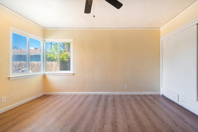 2744 E Michigan Ave, Fresno, CA 93703 - spare room featuring a ceiling fan, baseboards, and wood finished floors