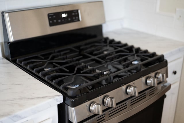2744 E Michigan Ave, Fresno, CA 93703 - kitchen view of stainless steel range with gas stovetop and light countertops