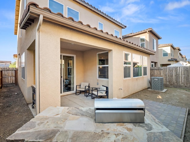 6053 E Brick Dr, Fresno, CA 93727 - rear view of property featuring a patio area, stucco siding, and a fenced backyard