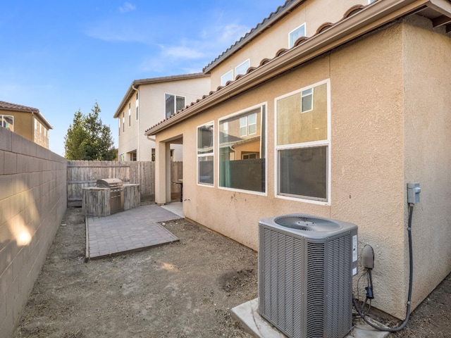 6053 E Brick Dr, Fresno, CA 93727 - fenced backyard featuring a patio area and area for grilling