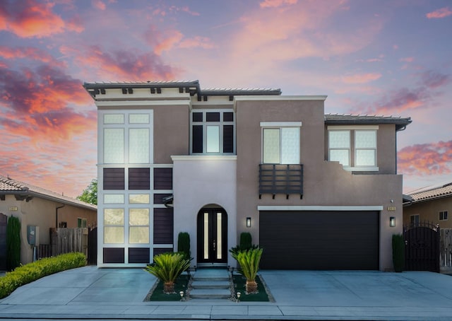 5615 N Lucy Ruiz Ave, Fresno, CA 93723 - view of front of home with stucco siding, driveway, an attached garage, and a gate