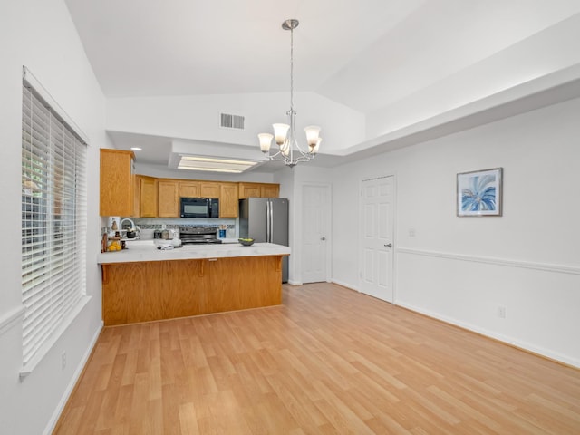 6185 N Milburn Ave, Fresno, CA 93722 - kitchen with appliances with stainless steel finishes, a peninsula, vaulted ceiling, light wood-style flooring, and light countertops