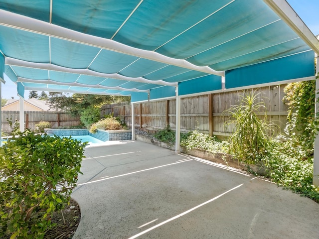 6185 N Milburn Ave, Fresno, CA 93722 - view of car parking featuring a fenced backyard