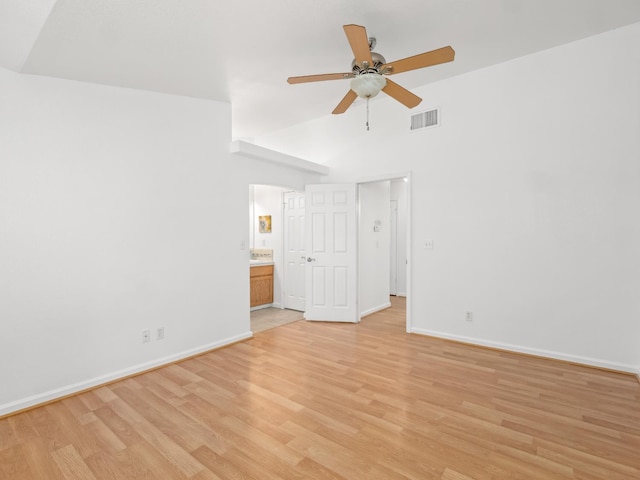 6185 N Milburn Ave, Fresno, CA 93722 - unfurnished bedroom featuring light wood-style flooring, baseboards, ensuite bathroom, a high ceiling, and ceiling fan
