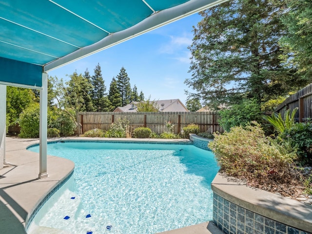 6185 N Milburn Ave, Fresno, CA 93722 - view of swimming pool featuring a fenced backyard