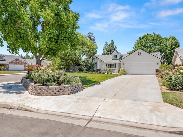 6185 N Milburn Ave, Fresno, CA 93722 - view of front facade featuring a garage, driveway, and a front lawn