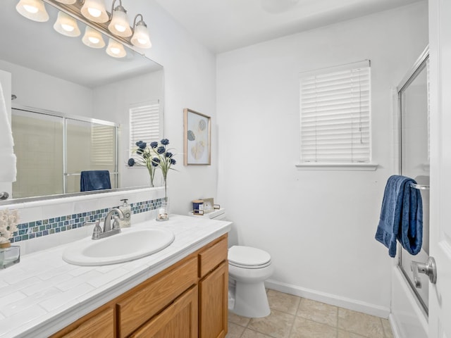 6185 N Milburn Ave, Fresno, CA 93722 - full bathroom with vanity, backsplash, baseboards, and toilet