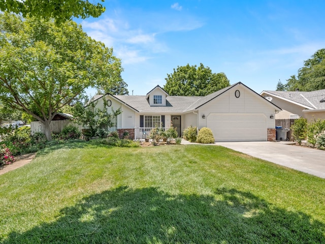 6185 N Milburn Ave, Fresno, CA 93722 - view of front of home with an attached garage, driveway, and covered porch