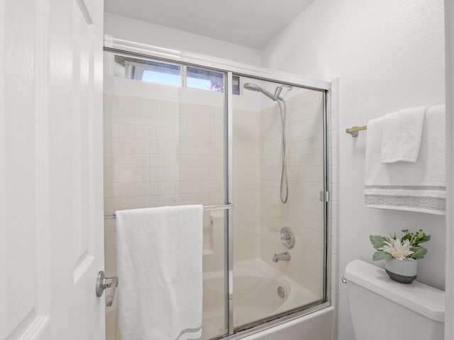 6185 N Milburn Ave, Fresno, CA 93722 - bathroom with enclosed tub / shower combo and toilet