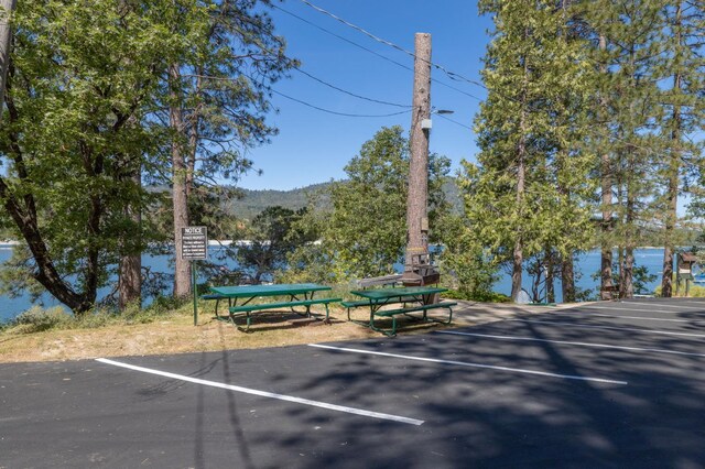 37731 Shoreline Dr, Bass Lake, CA 93604 - uncovered parking lot featuring a mountain view