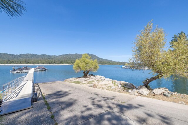 37731 Shoreline Dr, Bass Lake, CA 93604 - water view featuring a heavily wooded area