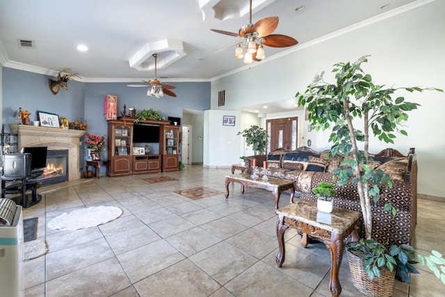 42462 Rd 140, Orosi, CA 93647 - living area featuring ceiling fan, ornamental molding, a glass covered fireplace, tile patterned floors, and baseboards