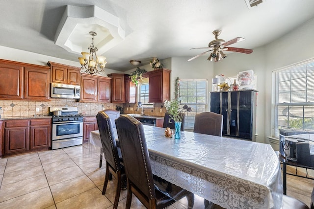 42462 Rd 140, Orosi, CA 93647 - dining area with a chandelier, ceiling fan, and light tile patterned floors