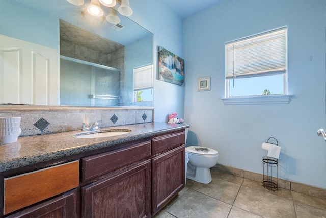 42462 Rd 140, Orosi, CA 93647 - bathroom featuring a stall shower, vanity, toilet, tile patterned flooring, and backsplash
