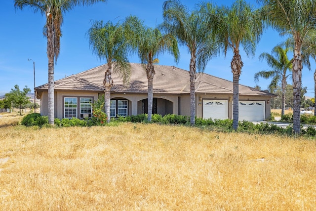 42462 Rd 140, Orosi, CA 93647 - single story home with stucco siding and a garage