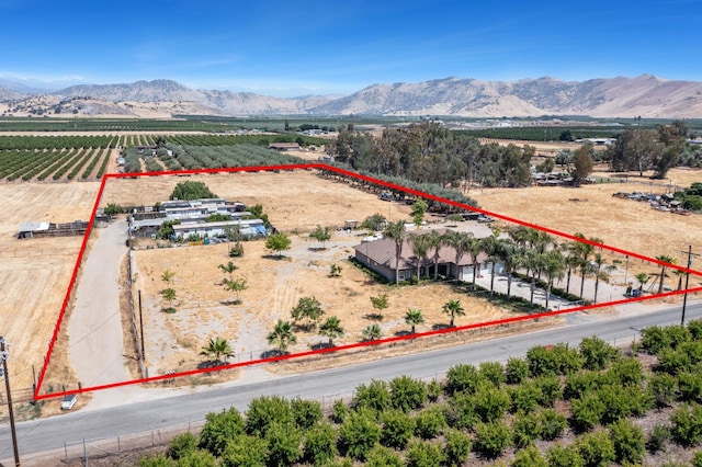 42462 Rd 140, Orosi, CA 93647 - overview of rural landscape with property parcel outlined, a mountainous background, and abundant farmland