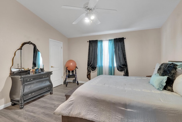 1775 E Cole Ave, Fresno, CA 93720 - bedroom featuring wood finished floors, baseboards, vaulted ceiling, and ceiling fan