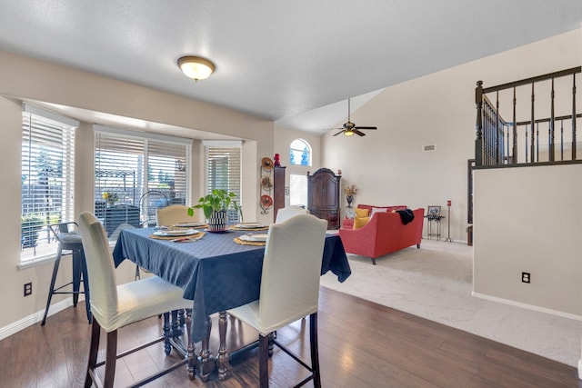 1775 E Cole Ave, Fresno, CA 93720 - dining area featuring baseboards, ceiling fan, wood finished floors, and vaulted ceiling