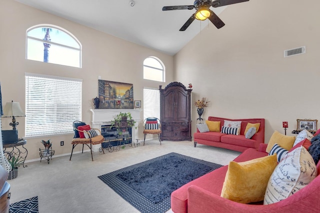 1775 E Cole Ave, Fresno, CA 93720 - living area with high vaulted ceiling, carpet flooring, ceiling fan, plenty of natural light, and a glass covered fireplace