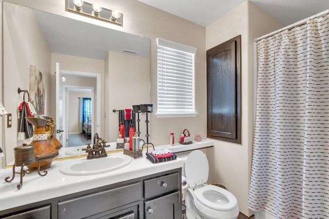1775 E Cole Ave, Fresno, CA 93720 - bathroom featuring vanity, toilet, and curtained shower