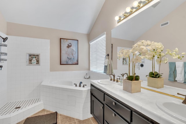 1775 E Cole Ave, Fresno, CA 93720 - full bathroom with a bath, double vanity, lofted ceiling, tile patterned floors, and a tile shower