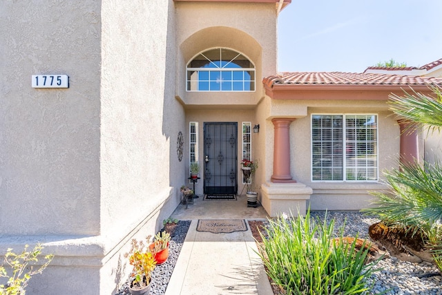 1775 E Cole Ave, Fresno, CA 93720 - property entrance featuring stucco siding and a tiled roof