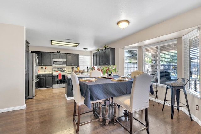 1775 E Cole Ave, Fresno, CA 93720 - dining area featuring healthy amount of natural light, wood finished floors, and baseboards