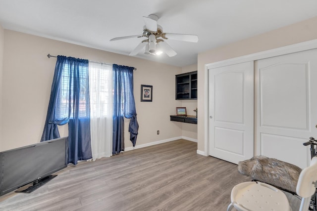 1775 E Cole Ave, Fresno, CA 93720 - sitting room with a ceiling fan, light wood-style flooring, and baseboards