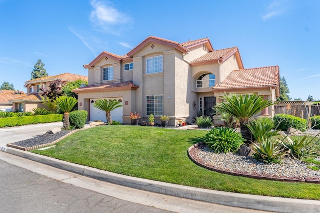 1775 E Cole Ave, Fresno, CA 93720 - mediterranean / spanish home with a tile roof, driveway, stucco siding, and an attached garage