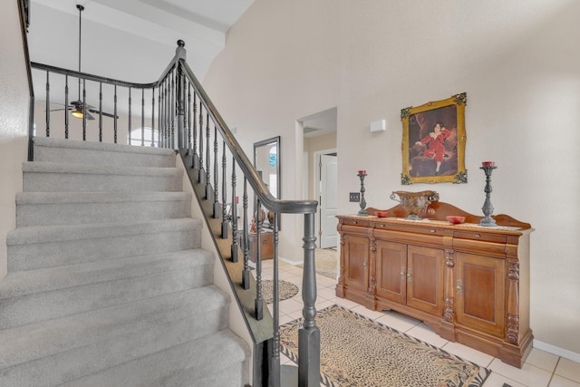 1775 E Cole Ave, Fresno, CA 93720 - stairs featuring tile patterned flooring, baseboards, a high ceiling, and a ceiling fan