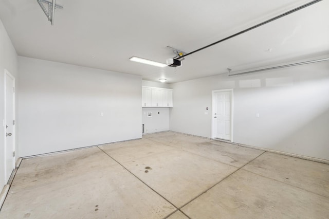 1061 Adell St, Madera, CA 93638 - garage featuring a garage door opener