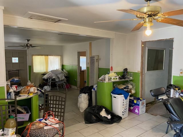 1425 S 3rd St, Fresno, CA 93702 - tiled dining space featuring ceiling fan, attic access, and a wainscoted wall