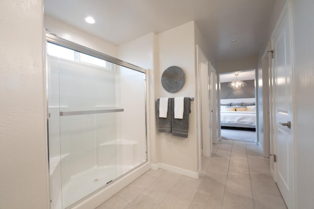 1157 Maclure Ave W, Madera, CA 93636 - ensuite bathroom with a shower stall, baseboards, and tile patterned flooring