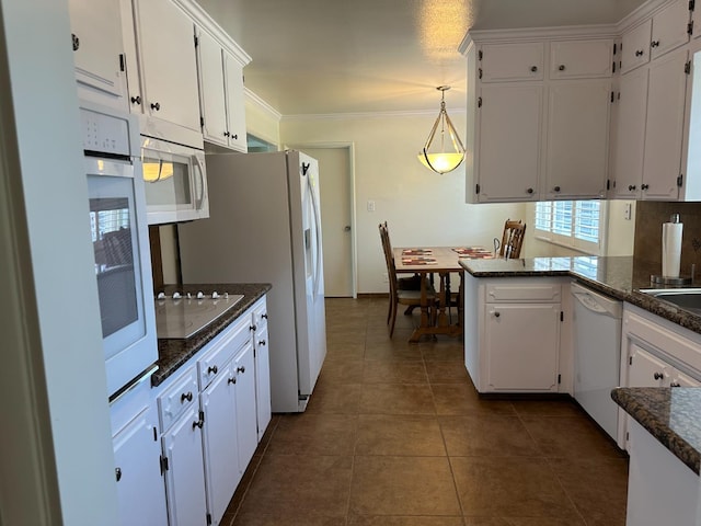 6538 N 4th St, Fresno, CA 93710 - kitchen featuring white appliances, white cabinetry, dark tile patterned flooring, decorative light fixtures, and ornamental molding