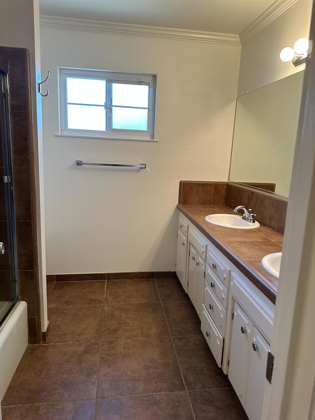 6538 N 4th St, Fresno, CA 93710 - full bath with double vanity, crown molding, tile patterned floors, and enclosed tub / shower combo