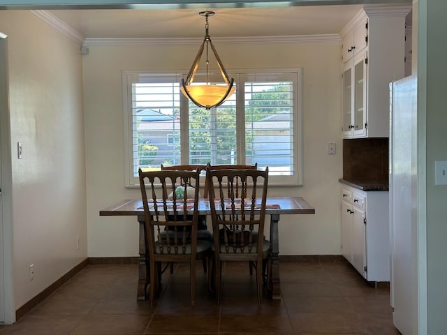 6538 N 4th St, Fresno, CA 93710 - dining room featuring crown molding and dark tile patterned floors