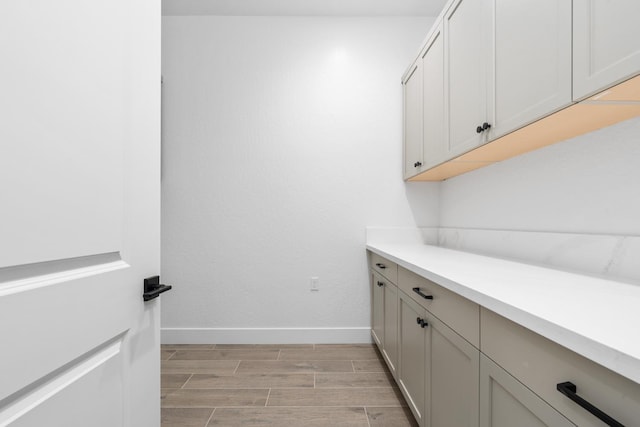 8152 Creek Vw, Friant, CA 93626 - laundry room featuring baseboards and wood tiled floors