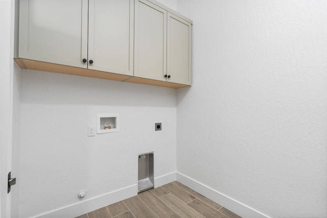 8152 Creek Vw, Friant, CA 93626 - laundry room featuring cabinet space, electric dryer hookup, light wood-style floors, and washer hookup