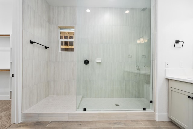 8152 Creek Vw, Friant, CA 93626 - full bathroom featuring a tile shower, vanity, and a walk in closet