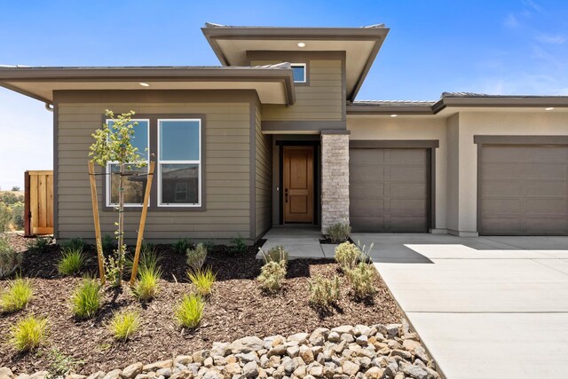 8152 Creek Vw, Friant, CA 93626 - view of front of home with a garage and driveway