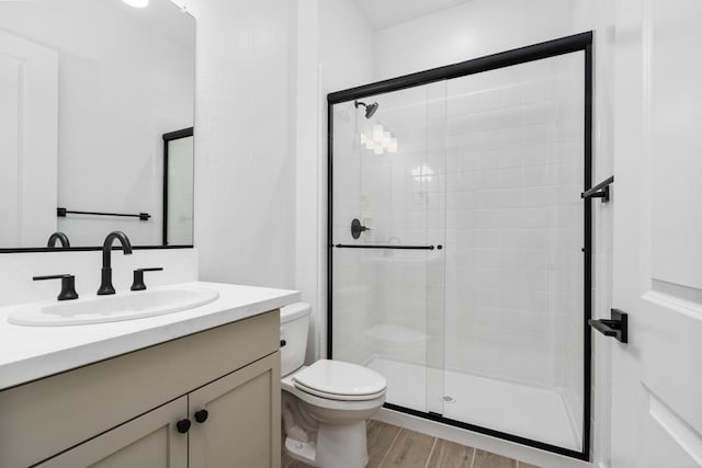 8152 Creek Vw, Friant, CA 93626 - full bath featuring vanity, a shower stall, and wood finished floors