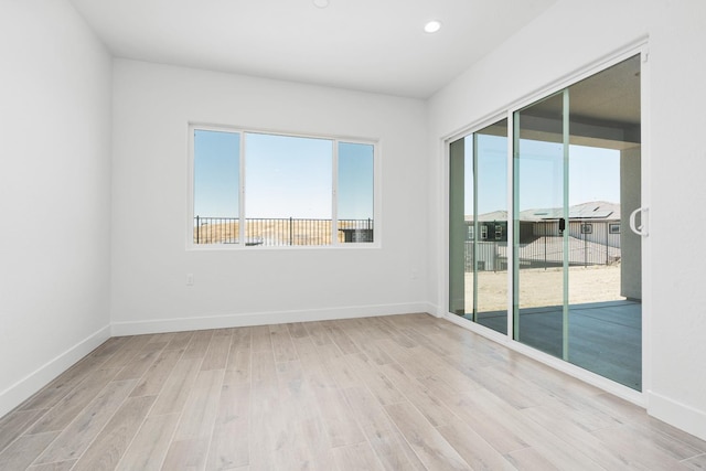 8152 Creek Vw, Friant, CA 93626 - empty room featuring healthy amount of natural light, light wood-type flooring, and recessed lighting