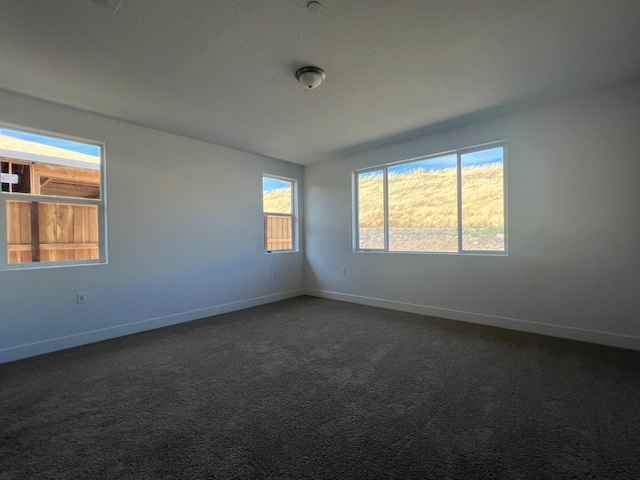 8131 Creek Vw, Friant, CA 93626 - unfurnished room featuring baseboards and dark carpet