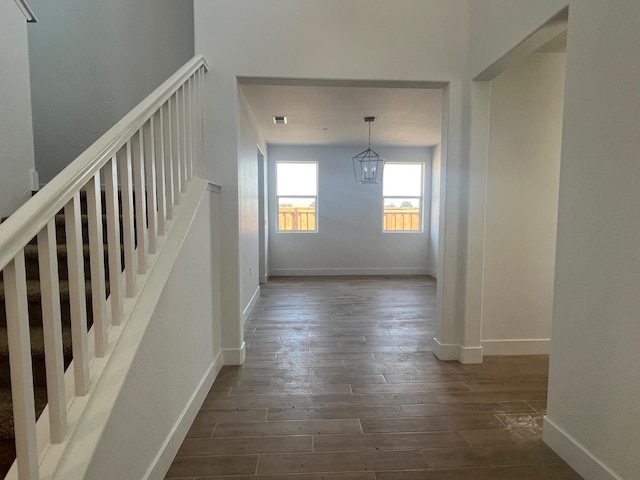 8131 Creek Vw, Friant, CA 93626 - staircase with wood finished floors, baseboards, and a chandelier