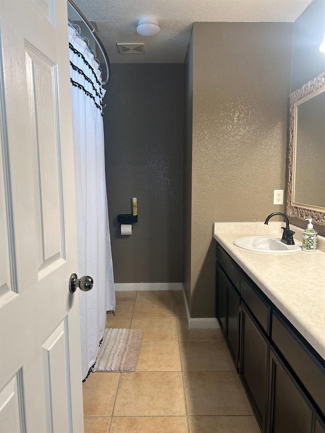 1561 Josephine Ct, Madera, CA 93638 - full bathroom featuring vanity, tile patterned flooring, and baseboards